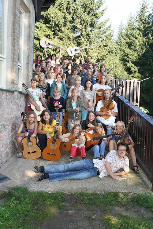 mass photo of summer camp with guitar from 2007