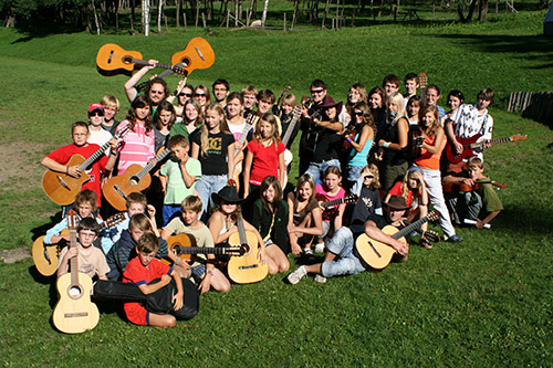 mass photo of summer camp with guitar from 2010