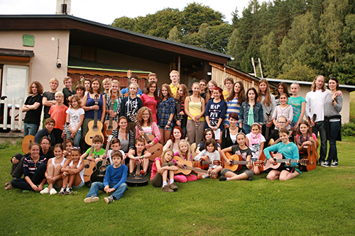 mass photo of summer camp with guitar from 2014