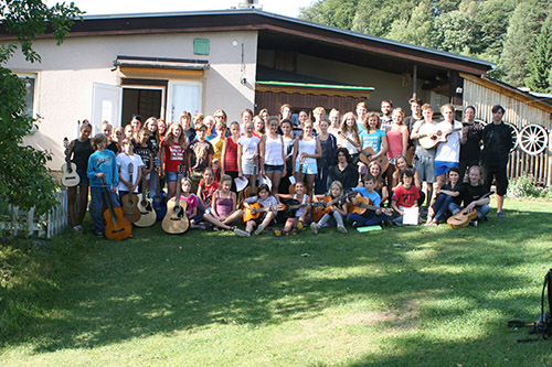 mass photo of summer camp with guitar from 2015