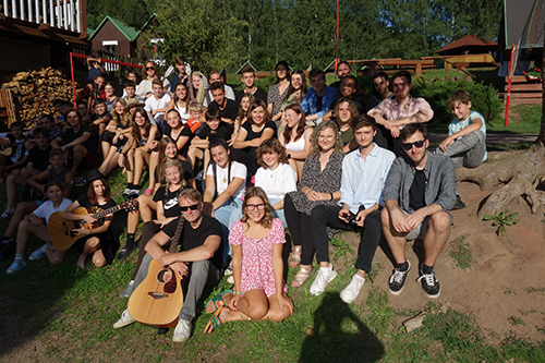 mass photo of summer camp with guitar from 2023